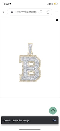 a pendant with the letter b on it