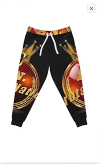 a black and gold sweatpants with a crown on them